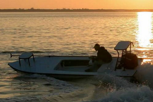 Enjoy a day on this beautifully designed 18' Hell's Bay skiff!