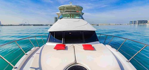 Explore Dubai’s Coastline in Comfort on the 62’ Blue water…
