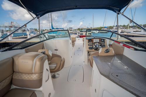 Discover West Bay surroundings on this Sundeck Hurricane boat